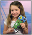 Girl Holding Holiday Sticker Sheets